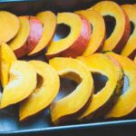 sliced fruit on black tray