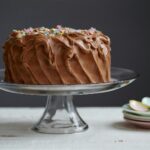 brown cake on clear glass cake stand