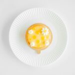 flat-lay photography of custard cake on white plate