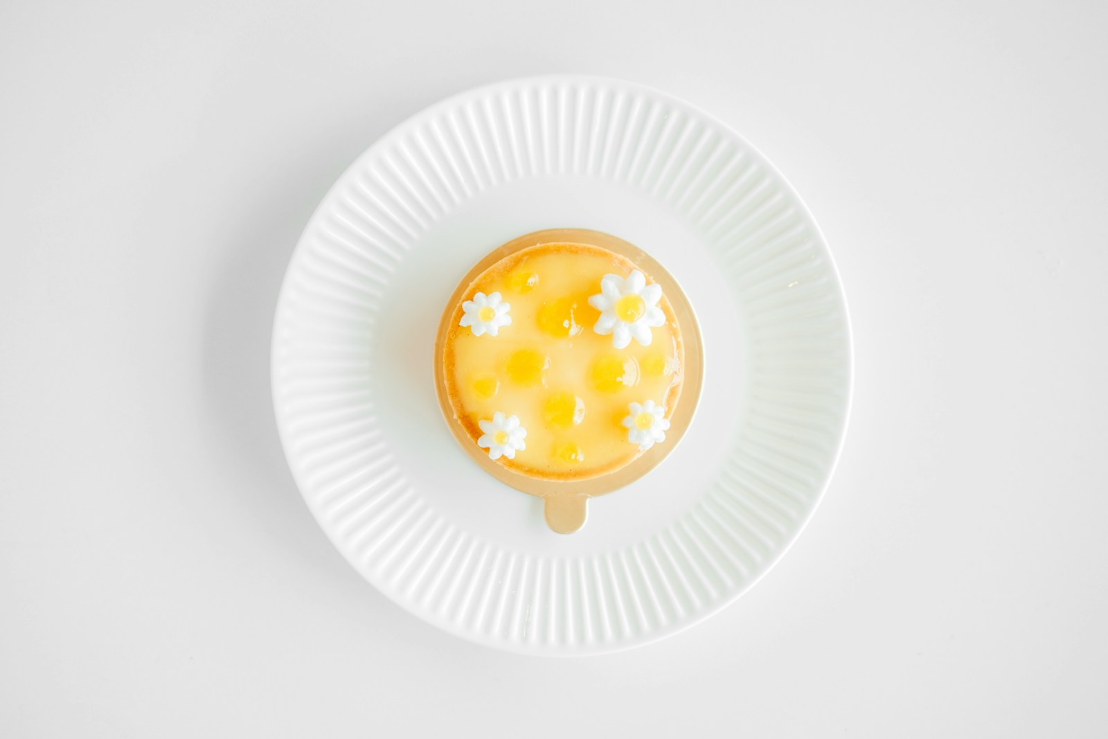 flat-lay photography of custard cake on white plate