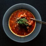 soup with vegetable on gray bowl