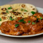 roti and meat slices with sauce on plate